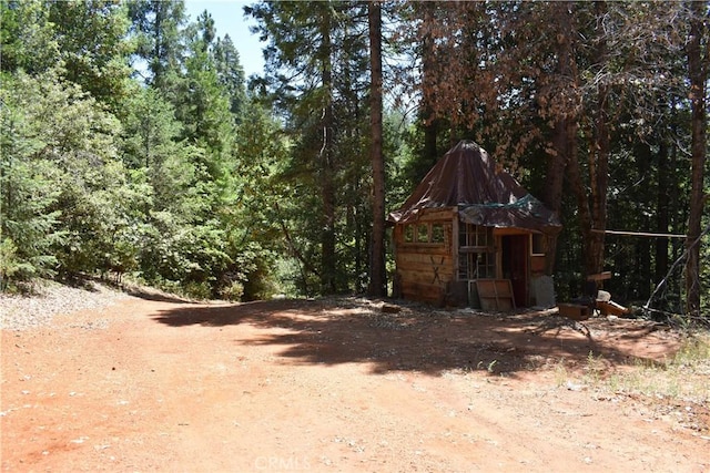 11605 La Porte Rd, Challenge, CA 95925 - view of yard with an outdoor structure and a forest view