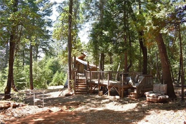11605 La Porte Rd, Challenge, CA 95925 - view of yard featuring a wooden deck, stairs, and a wooded view