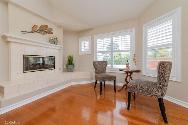 27860 Mount Shasta Way, Yorba Linda, CA 92887 - sitting room with light wood-type flooring, lofted ceiling, and a fireplace