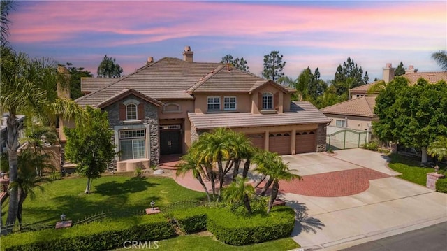 27860 Mount Shasta Way, Yorba Linda, CA 92887 - view of front of property featuring stone siding, concrete driveway, stucco siding, a lawn, and a tiled roof
