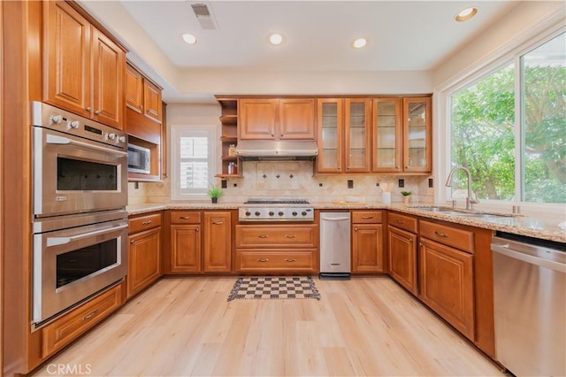 27860 Mount Shasta Way, Yorba Linda, CA 92887 - kitchen with appliances with stainless steel finishes, healthy amount of natural light, brown cabinetry, and recessed lighting