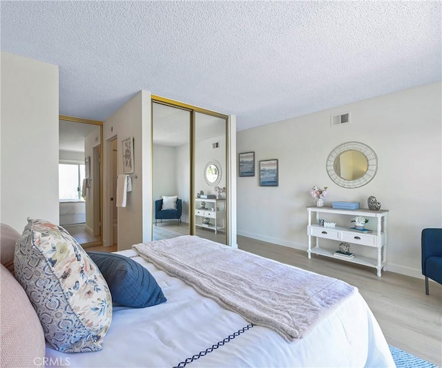 3610 Vista Glen Cir, Yorba Linda, CA 92886 - bedroom with a closet, wood finished floors, and a textured ceiling