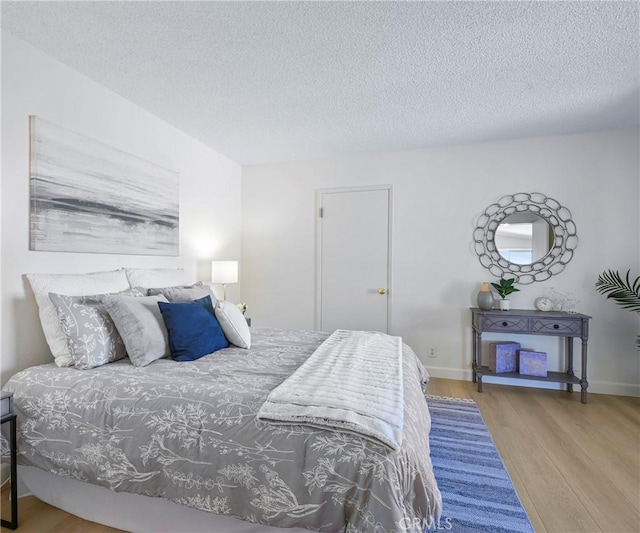 3610 Vista Glen Cir, Yorba Linda, CA 92886 - bedroom featuring wood finished floors and a textured ceiling