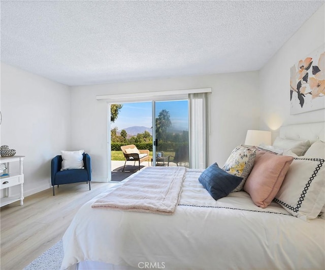 3610 Vista Glen Cir, Yorba Linda, CA 92886 - bedroom with access to outside, wood finished floors, and a textured ceiling