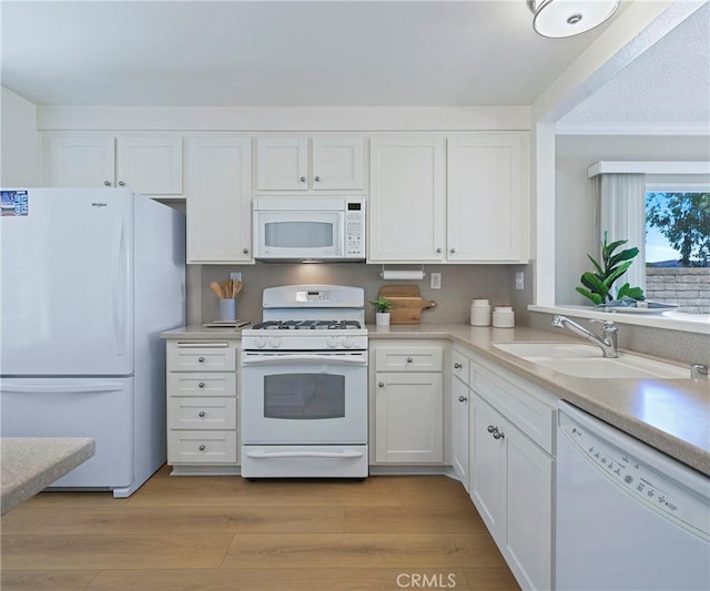 3610 Vista Glen Cir, Yorba Linda, CA 92886 - kitchen with white appliances, white cabinets, light countertops, and light wood-type flooring