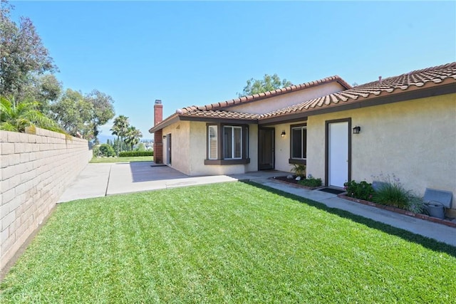 3610 Vista Glen Cir, Yorba Linda, CA 92886 - back of house featuring stucco siding, a patio, a chimney, and a tile roof