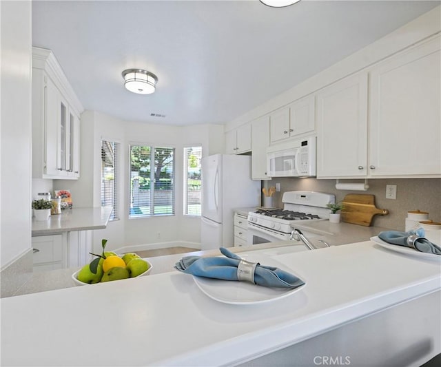 3610 Vista Glen Cir, Yorba Linda, CA 92886 - kitchen with white appliances, light countertops, and white cabinetry