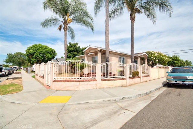 11457 Maza St, Norwalk, CA 90650 - view of front facade featuring a fenced front yard and stucco siding