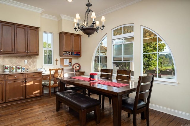 6767 Malachite Pl, Carlsbad, CA 92009 - dining room with a chandelier, dark wood-style flooring, ornamental molding, and recessed lighting