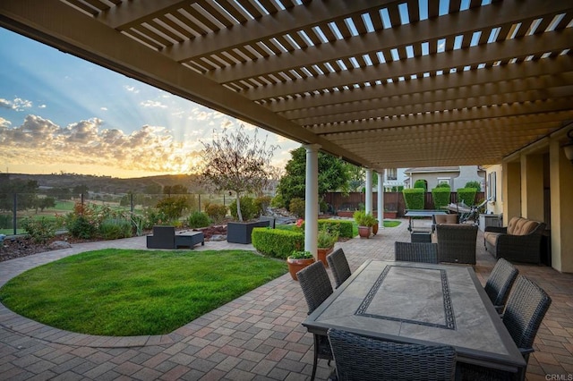 6767 Malachite Pl, Carlsbad, CA 92009 - patio terrace at dusk with outdoor dining space, a fenced backyard, a patio area, and a pergola
