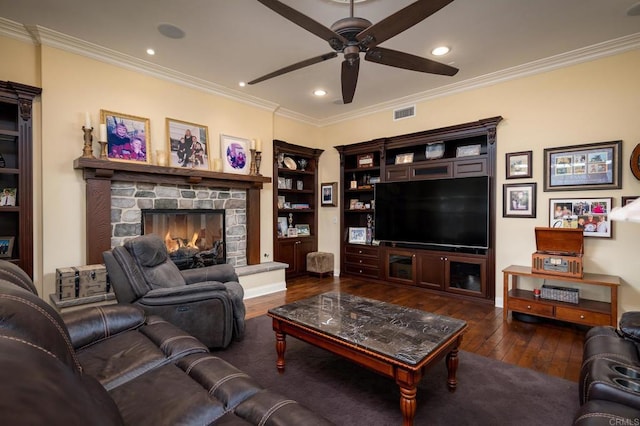 6767 Malachite Pl, Carlsbad, CA 92009 - living room with ceiling fan, crown molding, hardwood / wood-style floors, recessed lighting, and a stone fireplace