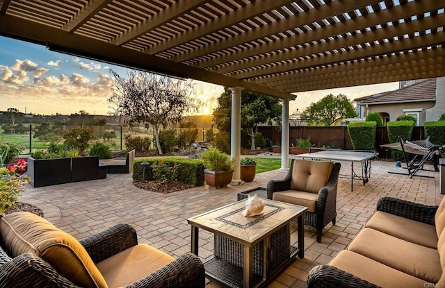 6767 Malachite Pl, Carlsbad, CA 92009 - patio terrace at dusk with an outdoor living space, a fenced backyard, a pergola, and a patio area