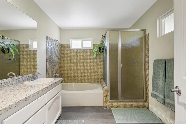 929 Chumash Trl, Vista, CA 92084 - bathroom with vanity, a bath, wood finished floors, and a shower stall