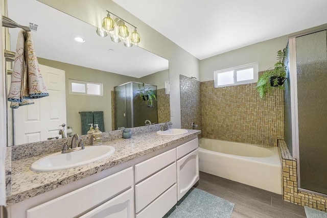 929 Chumash Trl, Vista, CA 92084 - full bath with wood finished floors, a bath, double vanity, and a shower stall