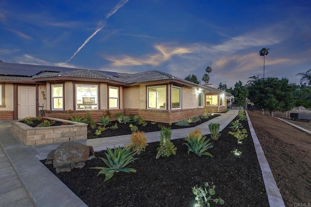 929 Chumash Trl, Vista, CA 92084 - ranch-style house with solar panels, stucco siding, and a tiled roof