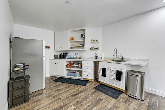 929 Chumash Trl, Vista, CA 92084 - kitchen featuring open shelves, freestanding refrigerator, white cabinets, and dark wood-style floors