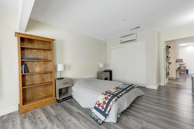 929 Chumash Trl, Vista, CA 92084 - bedroom with a wall mounted air conditioner, wood finished floors, and a closet