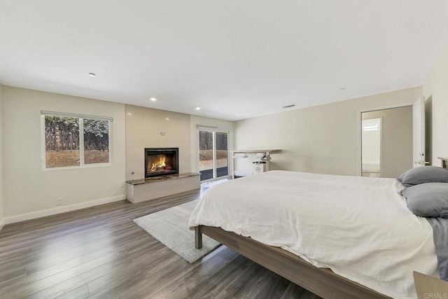 929 Chumash Trl, Vista, CA 92084 - bedroom with dark wood-style flooring, a large fireplace, recessed lighting, and access to outside