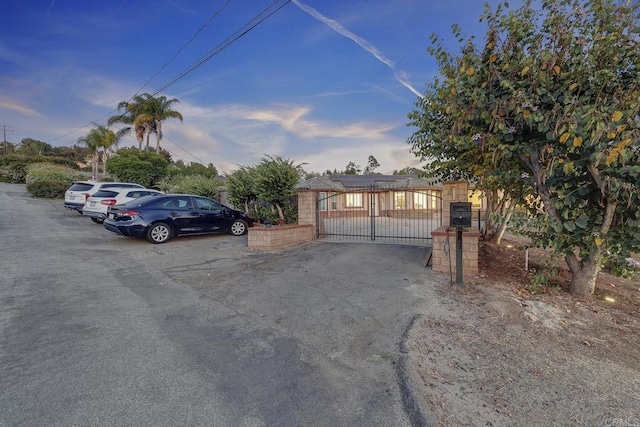 929 Chumash Trl, Vista, CA 92084 - obstructed view of property featuring a gate and solar panels