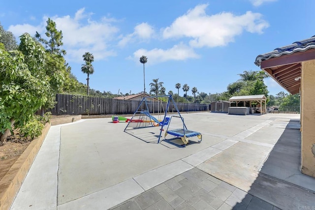 929 Chumash Trl, Vista, CA 92084 - view of playground with a fenced backyard and a storage unit