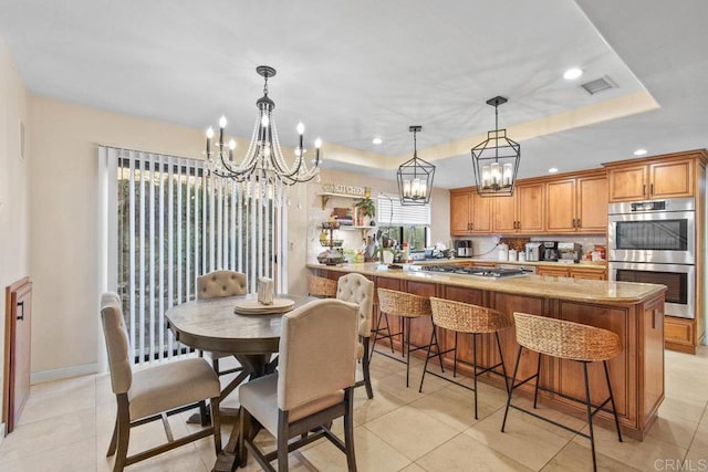 2044 Eula Ln, El Cajon, CA 92019 - dining space featuring a chandelier, recessed lighting, a tray ceiling, and light tile patterned flooring