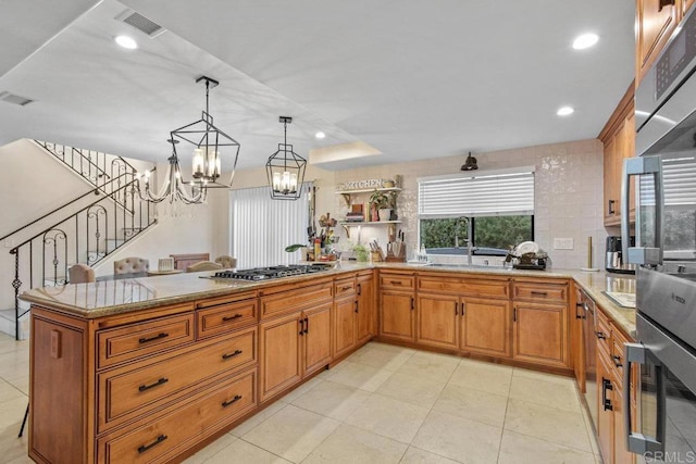 2044 Eula Ln, El Cajon, CA 92019 - kitchen featuring brown cabinetry, stainless steel appliances, a chandelier, pendant lighting, and recessed lighting