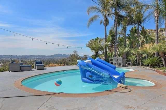 2044 Eula Ln, El Cajon, CA 92019 - view of pool featuring a patio, a mountain view, and a pool with connected hot tub