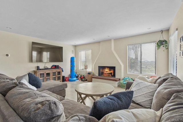 2044 Eula Ln, El Cajon, CA 92019 - living area featuring a warm lit fireplace and wood finished floors