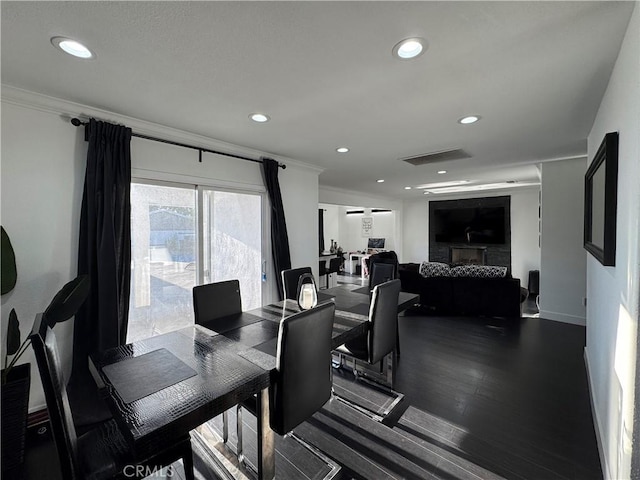 9135 Cord Ave, Downey, CA 90240 - dining room featuring recessed lighting, ornamental molding, and a fireplace