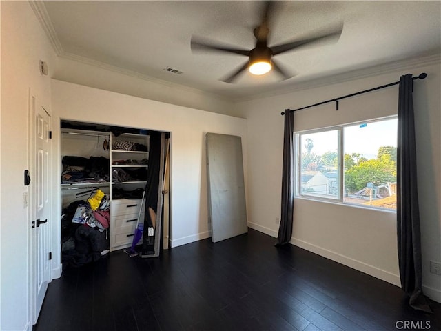9135 Cord Ave, Downey, CA 90240 - unfurnished bedroom featuring dark wood-type flooring, crown molding, a closet, and a ceiling fan