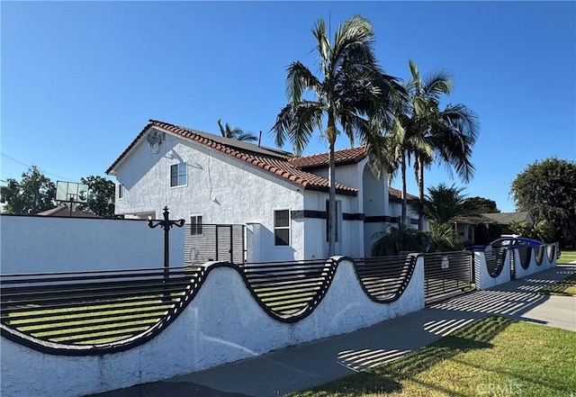 9135 Cord Ave, Downey, CA 90240 - view of side of property featuring stucco siding and a tile roof