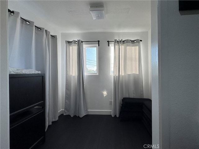 9135 Cord Ave, Downey, CA 90240 - unfurnished bedroom featuring baseboards and dark wood-style floors