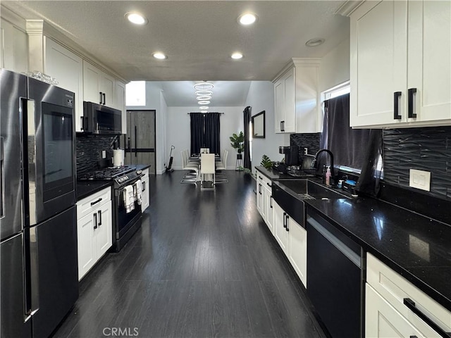 9135 Cord Ave, Downey, CA 90240 - kitchen featuring black appliances, backsplash, recessed lighting, dark wood-type flooring, and white cabinetry