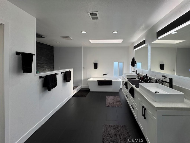 9135 Cord Ave, Downey, CA 90240 - bathroom featuring a freestanding tub, double vanity, recessed lighting, and a shower