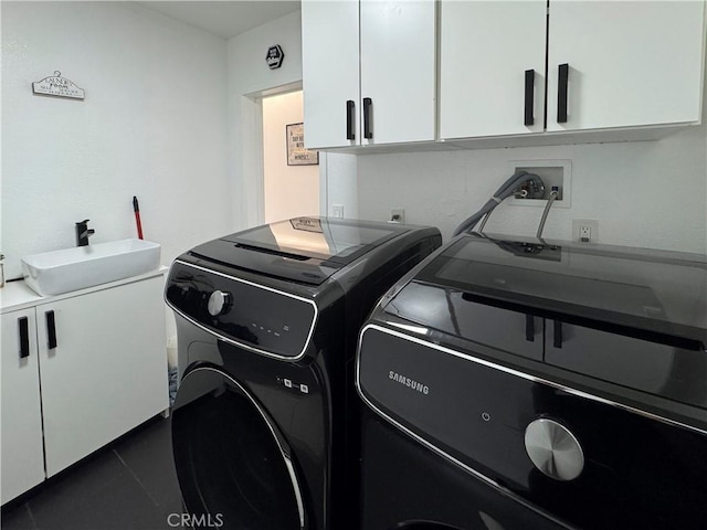 9135 Cord Ave, Downey, CA 90240 - washroom with cabinet space and independent washer and dryer