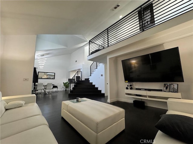 9135 Cord Ave, Downey, CA 90240 - living area with stairs, wood finished floors, and a high ceiling