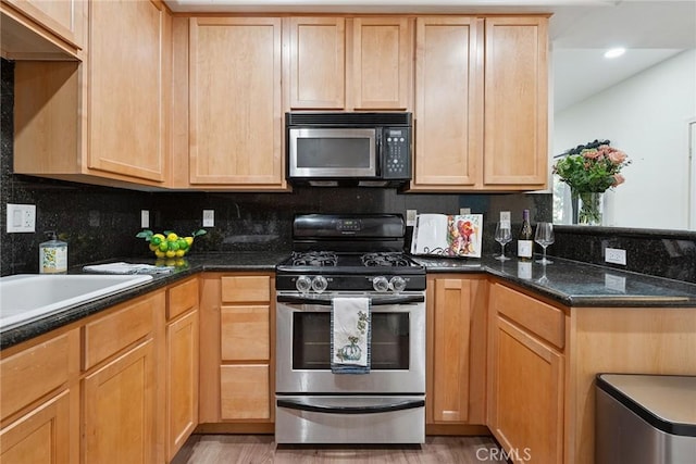 9610 Zelzah Ave Unit 105, Northridge, CA 91325 - kitchen featuring gas range, light brown cabinetry, light wood-style flooring, decorative backsplash, and recessed lighting