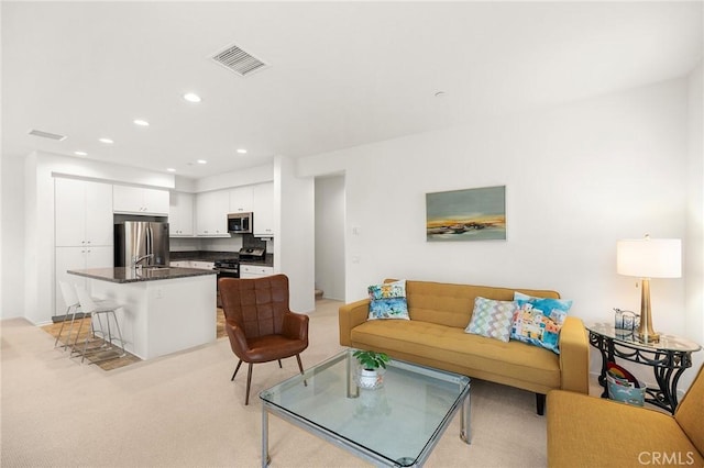 31268 Via Nubes, Temecula, CA 92592 - living room featuring recessed lighting and light colored carpet