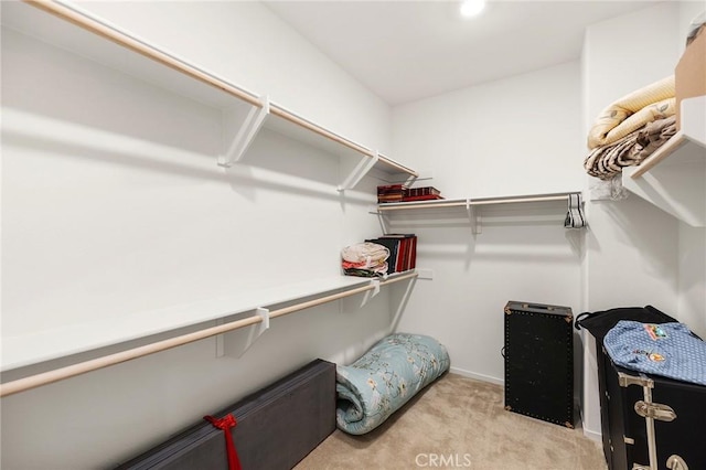 31268 Via Nubes, Temecula, CA 92592 - walk in closet featuring light colored carpet