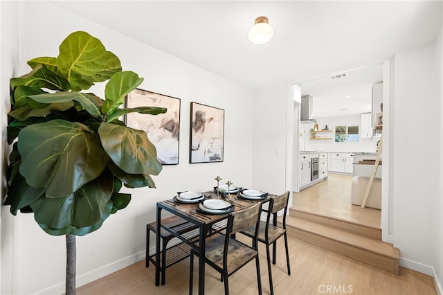 8252 Graves Ave, Rosemead, CA 91770 - dining space with light wood finished floors and baseboards