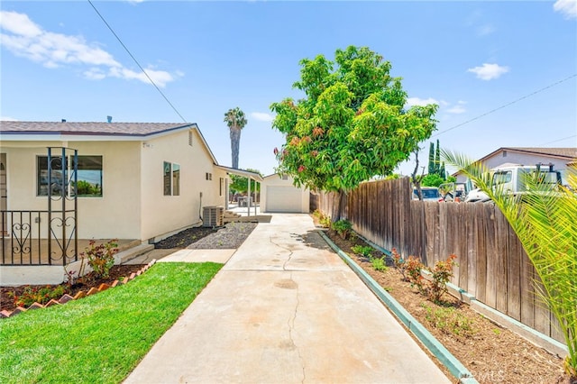 8252 Graves Ave, Rosemead, CA 91770 - view of yard with driveway, an outdoor structure, and a garage
