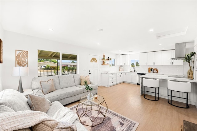 8252 Graves Ave, Rosemead, CA 91770 - living area featuring light wood-style flooring and recessed lighting