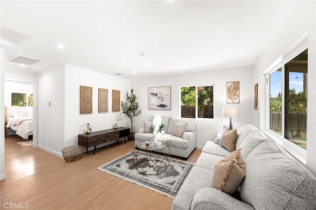 8252 Graves Ave, Rosemead, CA 91770 - living room featuring light wood finished floors, healthy amount of natural light, and recessed lighting
