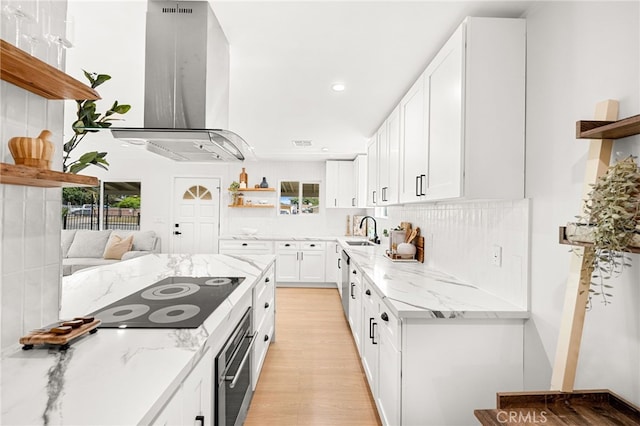 8252 Graves Ave, Rosemead, CA 91770 - kitchen featuring open shelves, island exhaust hood, black electric stovetop, white cabinetry, and stainless steel oven