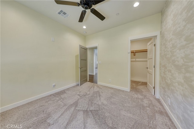 25904 Bear Valley Rd, Tehachapi, CA 93561 - unfurnished bedroom with light carpet, a spacious closet, recessed lighting, and a ceiling fan