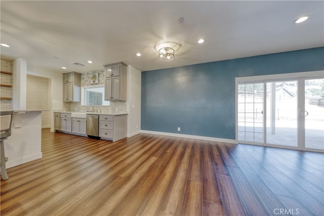 25904 Bear Valley Rd, Tehachapi, CA 93561 - kitchen featuring gray cabinets, dishwasher, light countertops, decorative backsplash, and recessed lighting