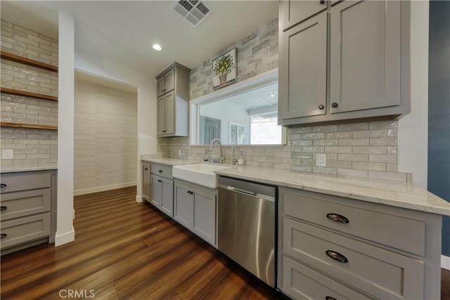 25904 Bear Valley Rd, Tehachapi, CA 93561 - kitchen with stainless steel dishwasher, gray cabinets, backsplash, dark wood-type flooring, and light stone counters