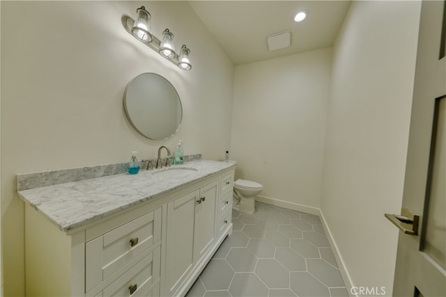 25904 Bear Valley Rd, Tehachapi, CA 93561 - bathroom featuring vanity, tile patterned flooring, and recessed lighting