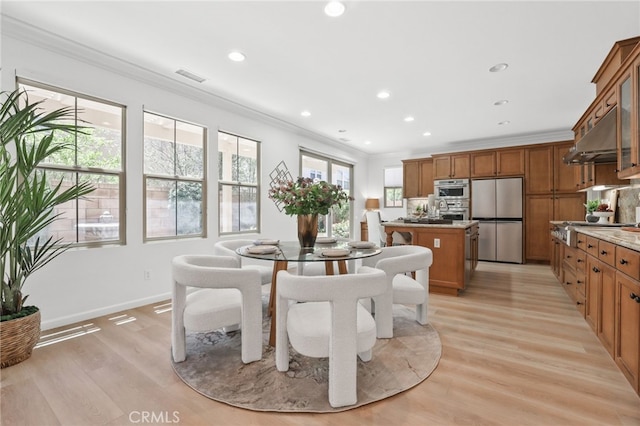 26 Los Indios, Irvine, CA 92618 - dining room with light wood-style flooring, ornamental molding, and recessed lighting