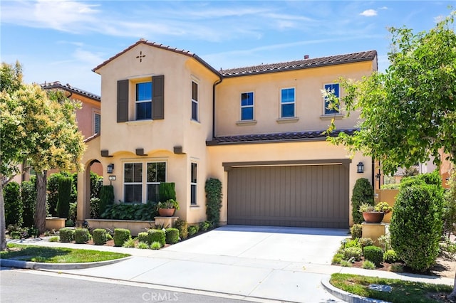 26 Los Indios, Irvine, CA 92618 - mediterranean / spanish home with a tile roof, a garage, concrete driveway, and stucco siding
